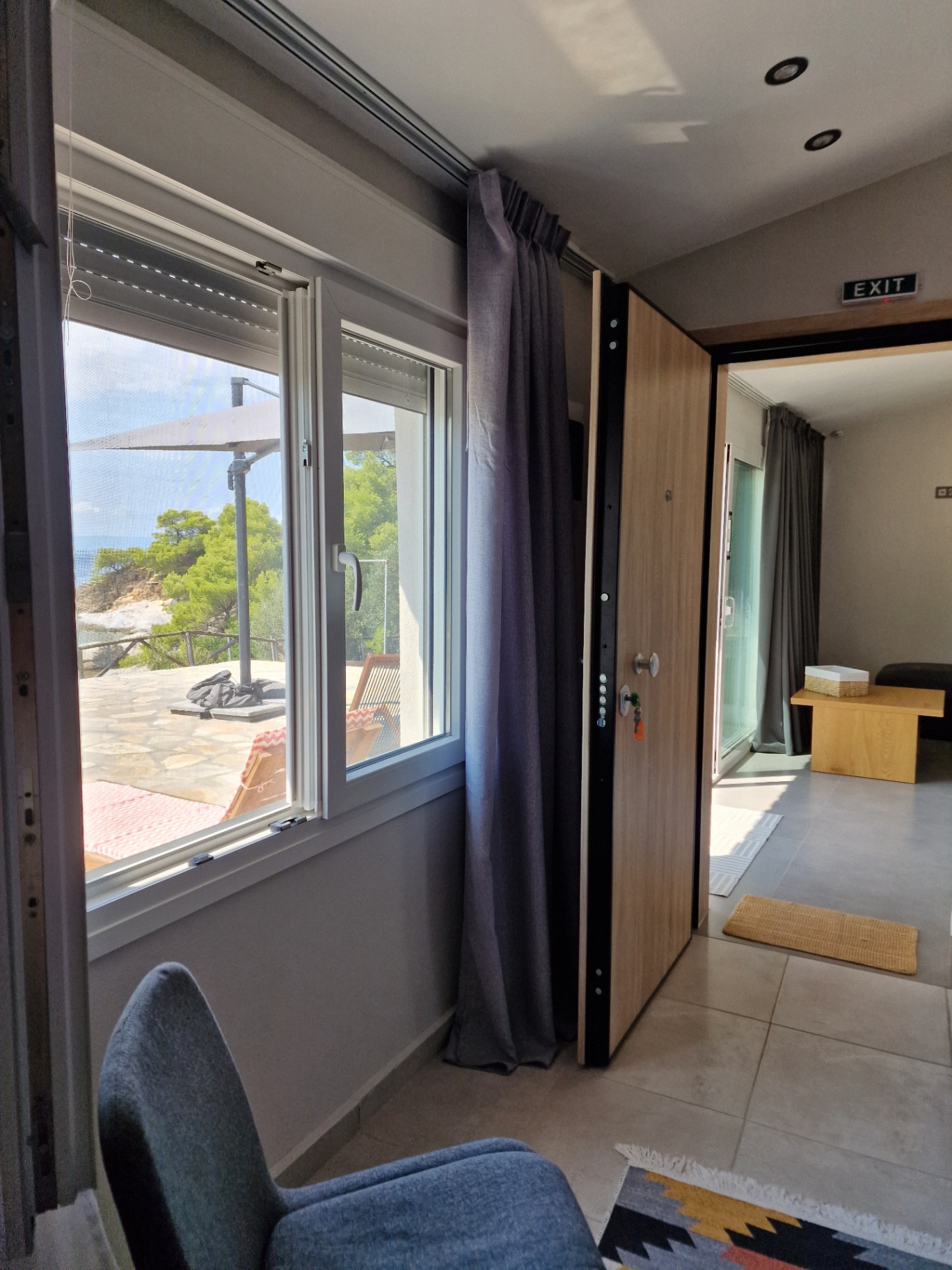 Window over the terrace and the doorway through to the living area