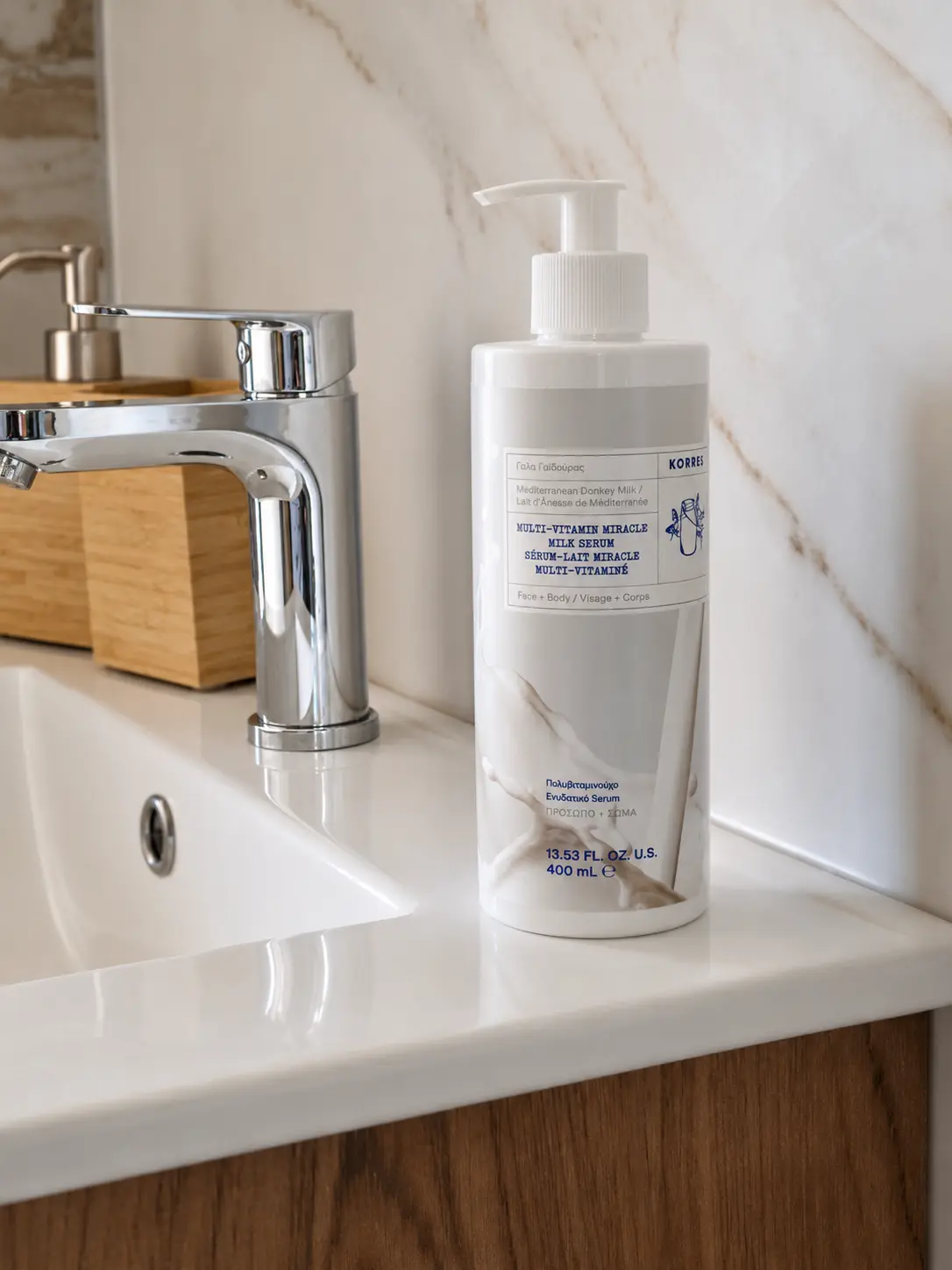 Korres serum on the marble bathroom counter