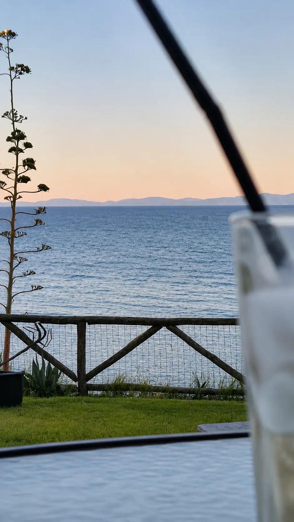 Soft evening colour over the sea from the terrace table
