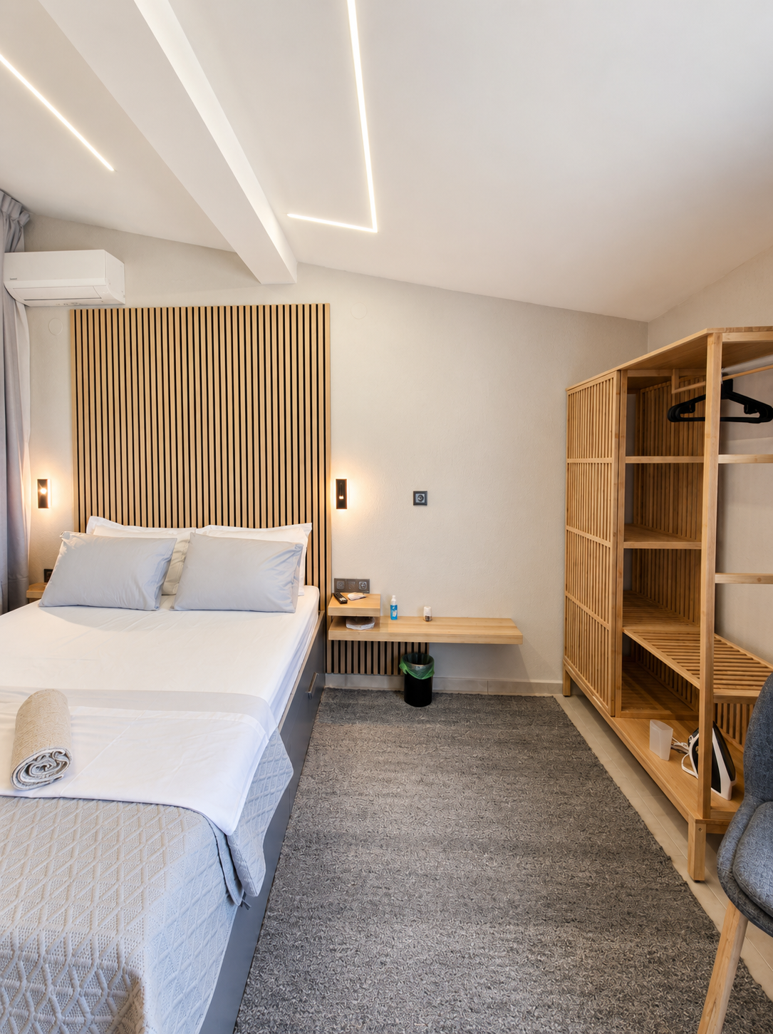 Bedside lamp and timber slat wall in warm light