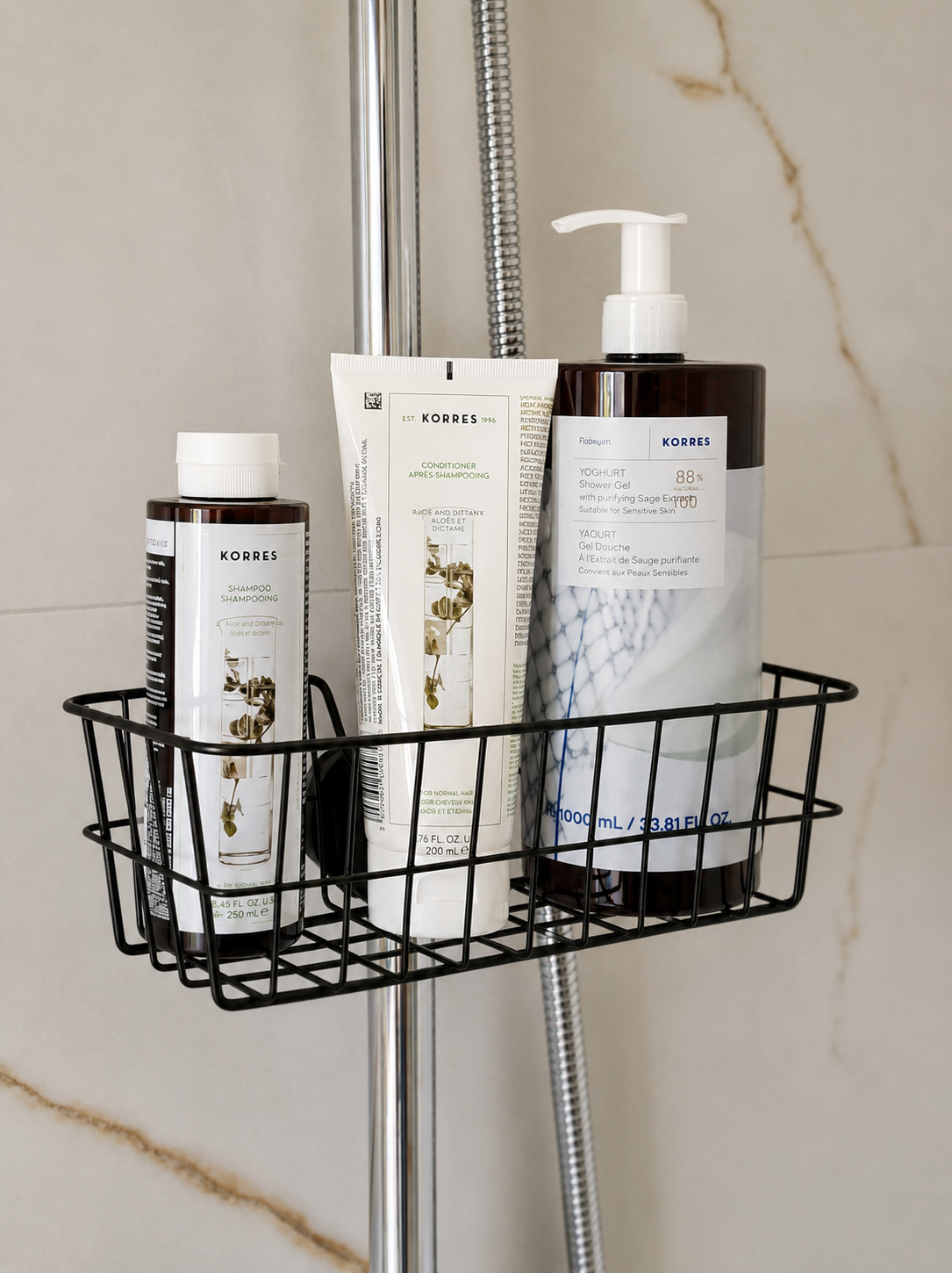 Korres shampoo, conditioner and shower gel arranged in the walk-in shower