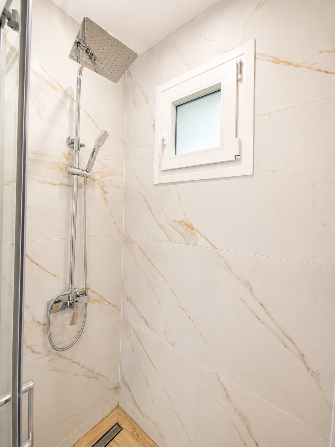 Marble shower with overhead rain head